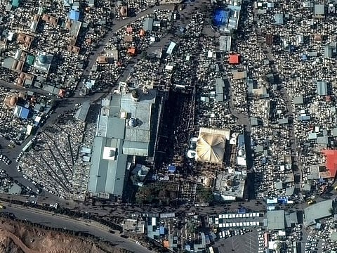 This image, provided by Maxar Technologies, shows a closer view of people gahter at the General Qassem Soleimani shrine at the martyr's cemetery in Kerman, Iran, on January 3, 2024 before the twin bomb blasts killed at least 103 people at an event honoring a prominent Iranian general slain in a US airstrike in 2020. 