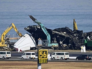 Crews begin clearing plane wreckage from Japan runway collision