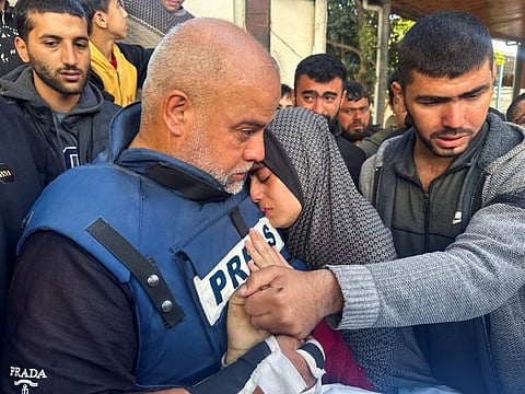 Al Jazeera journalist Wael Dahdouh with his daughter as they attend the funeral of his son, Palestinian journalist Hamza Dahdouh in Rafah in the southern Gaza Strip on January 7, 2024. 