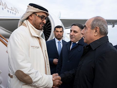Sheikh Mohamed Bin Zayed Al Nahyan, President of the United Arab Emirates (L), is received by Yagub Eyyubov, First Deputy Prime Minister of Azerbaijan (R), at Heydar Aliyev International Airport.