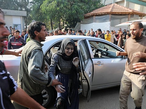 A Palestinian woman wounded in an Israeli strike arrives at the European Hospital, amid the ongoing conflict between Israel and Palestinian Islamist group Hamas, in Khan Younis in the southern Gaza Strip, on January 9, 2024.  