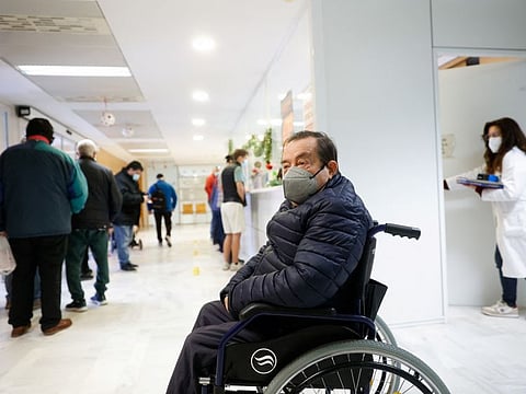 A man siting in a wheelchair wears a protective face mask at the Malvarrosa Health Centre, as health authorities in the province made the use of face masks compulsory in health centres due to the high number of patients with respiratory diseases, in Valencia, Spain, on January 5, 2024.  