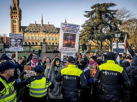 Police officers disperse protesters during a demonstration in support of Palestinian at the International Court of Justice (ICJ) on a genocide complaint by South Africa against Israel, in The Hague, on January 11, 2024.  