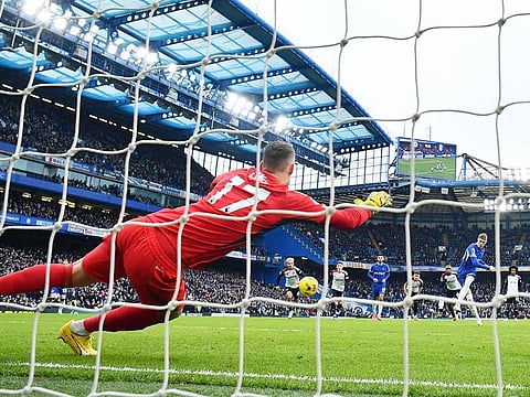 Chelsea's Cole Palmer scores their first goal from the penalty spot past Fulham's Bernd Leno. 