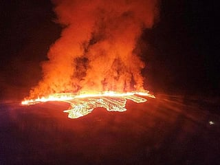 Photos: Iceland volcano erupts, lava flow crawls toward town
