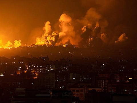 Fire and smoke rise following an Israeli airstrike, in Gaza City on October 8, 2023, a day after Hamas militants carried out a deadly attack in southern Israel. 
