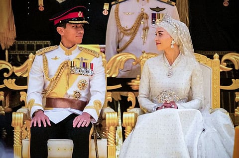 Prince Abdul Mateen and Yang Mulia Anisha Rosnah sit during their wedding reception at Istana Nurul Iman in Brunei's capital Bandar Seri Begawan on January 14, 2024. Lavish celebrations for the wedding of Brunei's Prince Abdul Mateen and his wife reached a climax on January 14 with a glittering ceremony attended by government leaders and blue-blooded guests from Asia and the Middle East.  