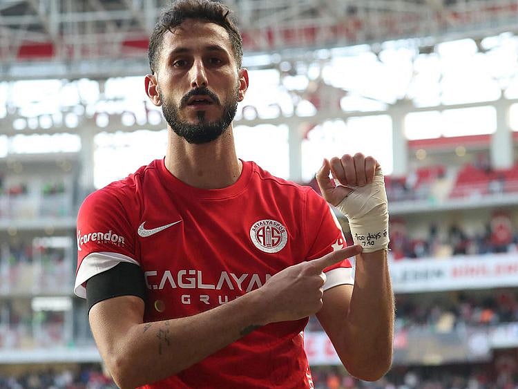 Israeli forward Sagiv Jehezkel displaying a bandage on his wrist reading “100 days. 07/10” after scoring a goal during Turkish Super league match between Antalyaspor and Trabzonspor at Corendon Airlines Park Antalya Stadium, in Antalya on January 14, 2024. 