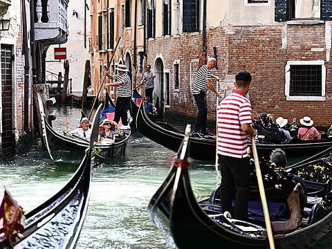 Tourist enjoy gondola rides on September 3, 2023 in Venice.