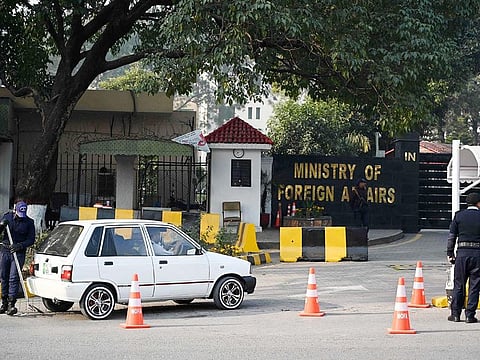 A Pakistani police officer checks a vehicle stand entering the Ministry of Foreign Affairs in Islamabad on January 18, 2024. Pakistan said on Thursday it had carried out strikes against militant targets in Iran, after Tehran launched attacks on Pakistani territory earlier this week. 