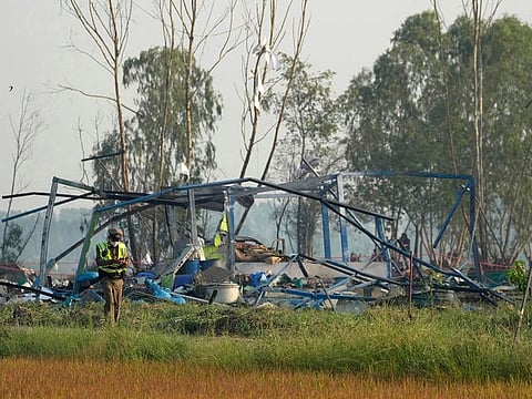 Thai police officer walks at the scene of an explosion at a firework factory in Suphan Buri province, Thailand, Thursday, Jan. 18, 2024. 