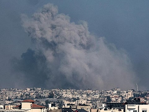A picture taken from Rafah shows smoke billowing over Khan Yunis in the southern Gaza Strip during Israeli bombardment on January 20, 2024. 
