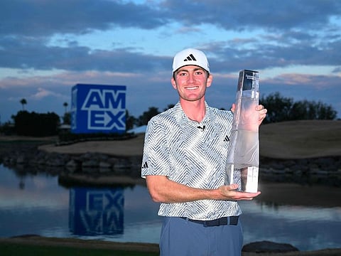 Nick Dunlap of the United States with the trophy after winning The American Express at Pete Dye Stadium Course on Monday.