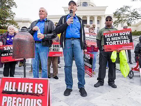 Former death row inmates who were exonerated, from left, Randall Padgent, Gary Drinkard and Ron Wright, were among the nearly one hundred protestors gathered at the state capitol building in Montgomery, Alabama, on Tuesday January 23, 2024, to ask Governor Kay Ivey to stop the planned execution of Kenneth Eugene Smith.  