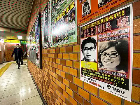 This picture taken on January 26, 2024 in a train station of Chuo district in Tokyo shows a poster of Satoshi Kirishima, who was a member of The East Asia Anti-Japan Armed Front, a radical leftist organization responsible for bombing attacks in Japan's capital in the 1970s. 