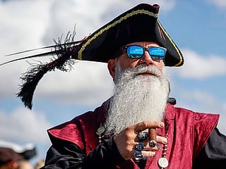 Photos: Revellers in festive dress fill downtown Tampa, Florida, for the annual Gasparilla Pirate Fest