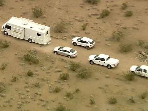 Vehicles where several people were found shot to death in El Mirage, California.