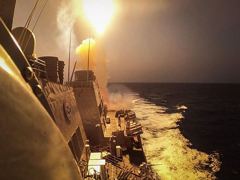 This handout picture courtesy of the US Navy shows the Arleigh Burke-class guided-missile destroyer USS Carney (DDG 64) defeating a combination of Al Houthi missiles and unmanned aerial vehicles in the Red Sea.  