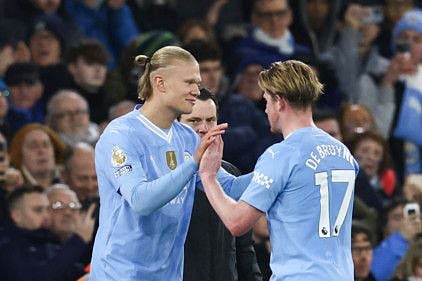 Manchester City's midfielder Kevin De Bruyne (right) leaves the pitch as striker Erling Haaland enters during the English Premier League match against Burnley at the Etihad Stadium in Manchester on Wednesday.