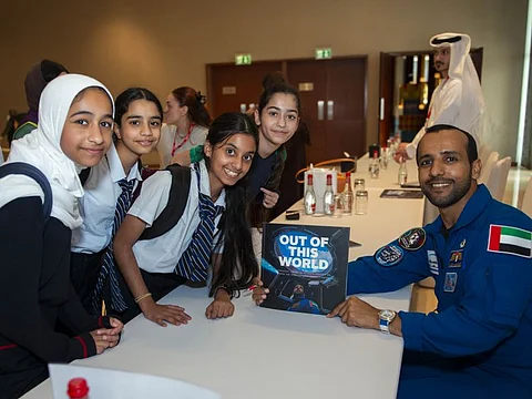 UAE astronaut Hazza Al Masnouri with children during his book signing ceremony at the Emirates Airline Festival of Literature on Friday. 