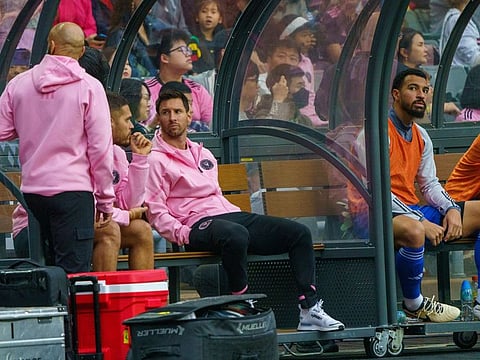 Lionel Messi sits on the bench during a match between Inter Miami and the Hong Kong XI in Hong Kong, China, on Sunday.
