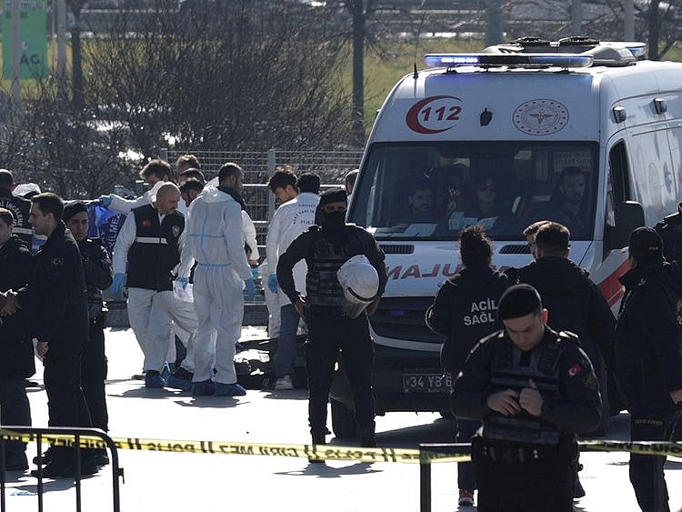 Forensic experts examine the area after a shooting outside the Caglayan courthouse in Istanbul on February 6, 2024.  