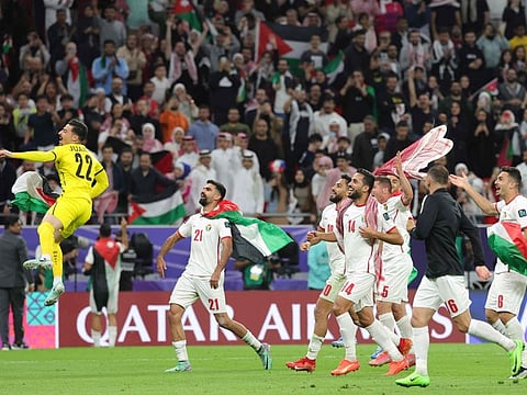 Jordan's players celebrate after defeating South Korea at the end of the Qatar 2023 AFC Asian Cup semi-final football match at the Ahmad Bin Ali Stadium in Al Rayyan, west of Doha, on Tuesday.