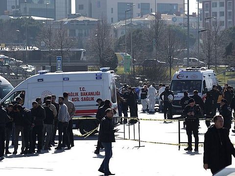 Police forensic experts examine the area after a shooting outside the Caglayan courthouse in Istanbul, Turkey February 6, 2024.