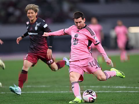 Inter Miami CF forward Lionel Messi shoots against Vissel Kobe during the second half of a preseason friendly at Japan National Stadium.
