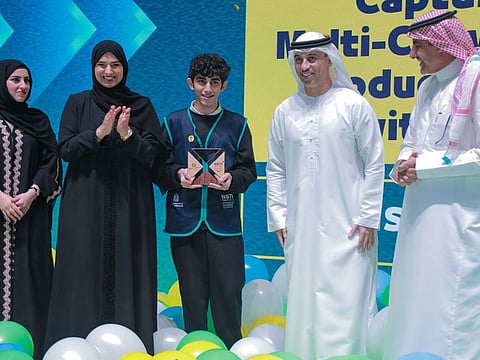Saif Hassan Ibrahim Muhammad Karam (centre), from the Secondary Model School for boys in Sharjah, who secured first place in the Emirates Young Scientist Competition, was honoured during the closing ceremony of the 7th National Science, Technology and Innovation (NSTI) Festival in the presence of Dr. Ahmad Belhoul Al Falasi (second fromm right), UAE Minister of Education, and other distinguished officials.