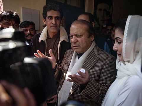 Nawaz Sharif, Pakistan’s former prime minister, and his daughter Maryam Nawaz Sharif at a polling station in Lahore on February 8, 2024.  