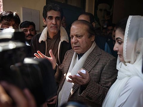 Nawaz Sharif, Pakistan’s former prime minister, and his daughter Maryam Nawaz Sharif at a polling station in Lahore on February 8, 2024.  