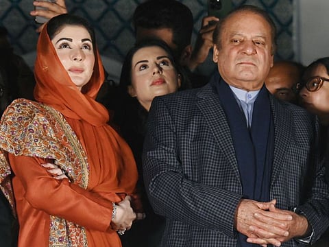 Pakistan's former Prime Minister Nawaz Sharif  and leader of the Pakistan Muslim League (PML) party, next to his daughter Maryam Nawaz, attend a gathering with supporters a day after Pakistan's national elections, in Lahore on February 9, 2024.  