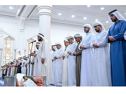 His Highness Sheikh Humaid bin Rashid Al Nuaimi, Supreme Council Member and Ruler of Ajman, and Sheikh Ammar bin Humaid Al Nuaimi, Crown Prince of Ajman and Chairman of Ajman Executive Council, performing the funeral prayer at Sheikh Zayed Mosque in Al Jurf on Sunday