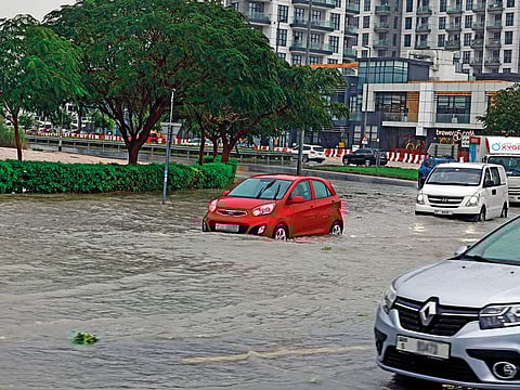 Several motorists left their cars parked on flooded streets during Tuesday's rains. 