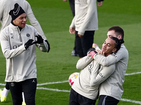 Paris St Germain's Ethan Mbappe with Kylian Mbappe and teammates during training at Paris-Saint-Germain Training Centre, Poissy, France on Tuesday.