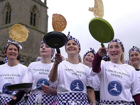 Photos: Women sprint through centuries-old English pancake race