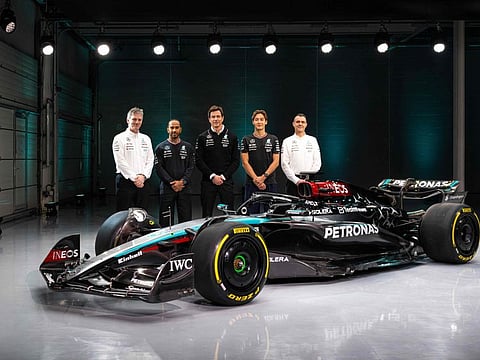 British driver George Russell (2R), Team principal Toto Wolff (C), British driver Lewis Hamilton (2L), Technical Director James Allison (L) and Magaging Director of HPP, Hywel Thomas (R) posing with their new Mercedes-AMG F1 W15 E Performance Formula One racing car during their 2024 season launch, in Silverstone on Wednesday.