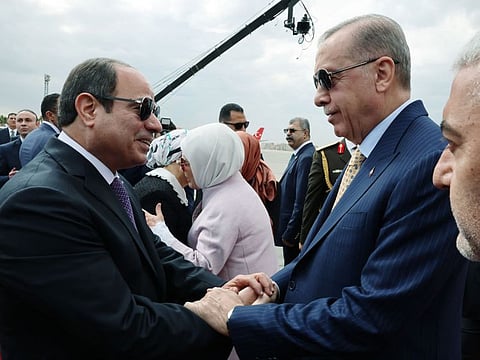 Erdogan (right) being welcomed by his Al Sissi as he arrives at Cairo International Airport during his official visit to Egypt.  