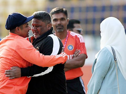 Sarfaraz Khan hugs his teary-eyed father after receiving his debut Test cap before the start of the third Test against England in Rajkot on Thursday.