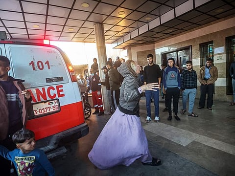 A woman reacts as injured Palestinians are brought to Nasser hospital in Khan Younis in the southern Gaza Strip following Israeli bombardment. Gaza’s hospitals have been a focal point of the four-month-old war between Israel and Palestinian militant group Hamas, which controls the besieged territory. 
