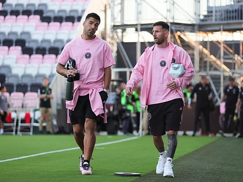 Inter Miami CF forward Luis Suarez (left) and forward Lionel Messi arrive to the game against Newell's Old Boys at DRV PNK Stadium.