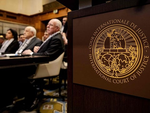 Minister of Foreign Affairs of the Palestinian Authority Riyad Al Maliki (right) and members of his delegation as they listen at the start of a hearing at the ICJ on the legal consequences of the Israeli occupation of Palestinian territories, in The Hague on February 19, 2024.  