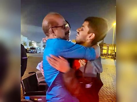 Still from a clip of the teen, Felix (R), reuniting with dad Jeby Thomas in the wee hours of Monday