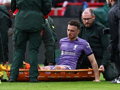 Liverpool's Diogo Jota is placed on a stretcher after sustaining an injury during a Premier League against Brentford at Brentford Community Stadium, London, on February 17.