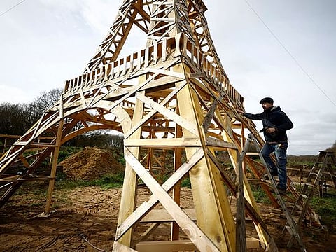 Photos: Two friends build Eiffel Tower from recycled wood ahead of Olympics 
