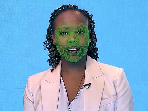 A green wireframe model covers an actor's lower face during the creation of a synthetic facial reanimation video, known alternatively as a deepfake, in London.