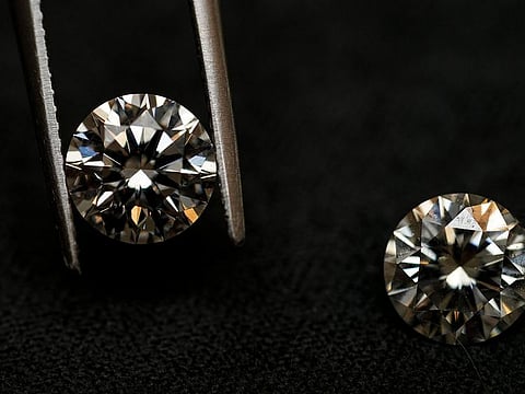A lab grown diamond, left, and a natural diamond are displayed at Bario Neal, a jewelry store, in Philadelphia.