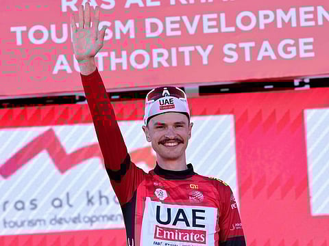 UAE Team Emirates' Australian cyclist Jay Vine celebrates on the podium after the third stage of the 6th UAE Cycling Tour on Wednesday.