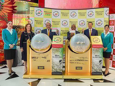 DDF representatives with the two winning tickets at Concourse C of Dubai International Airport on Wednesday